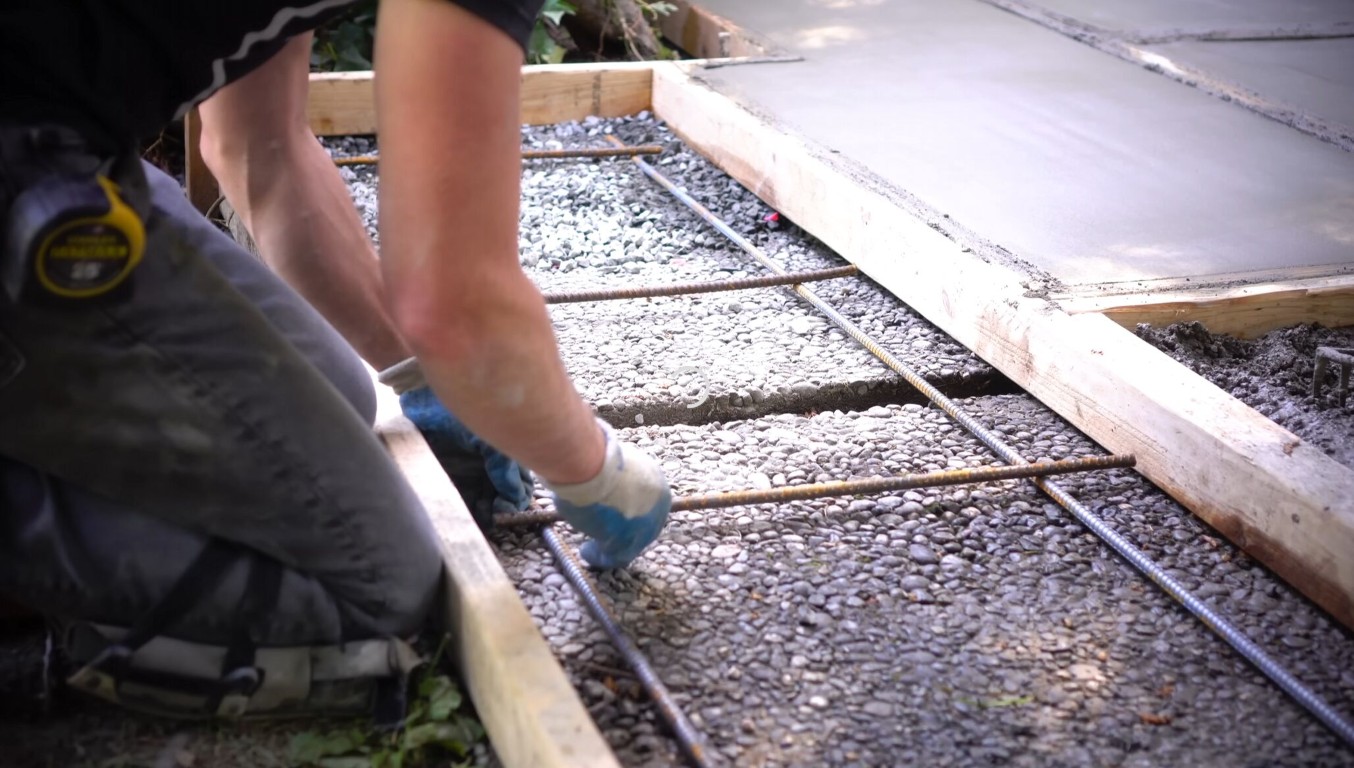 Concrete repair with rebar reinforcement during sidewalk replacement project