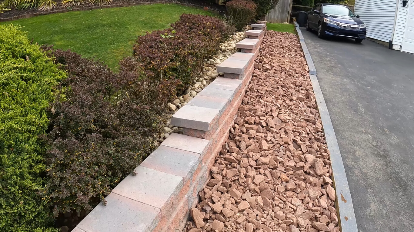 Concrete steps and retaining wall installation for a residential property